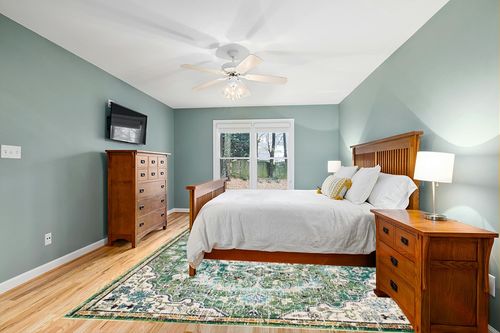 SAFAVIEH Madison Collection Area Rug - 9' x 12', Green & Turquoise, Boho Chic Medallion Distressed Design, Non-Shedding & Easy Care, Ideal for High Traffic Areas in Living Room, Bedroom (MAD447Y) in Teal and Orange Wood Bedroom