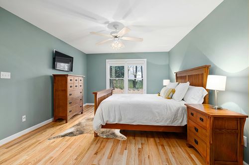 Loloi II Odessa Collection ODE-01 Mocha/Sand 5' x 6'-6" Area Rug in Teal and Orange Wood Bedroom