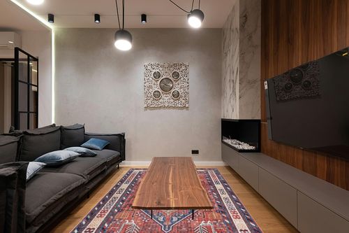 nuLOOM Stella Machine Washable Traditional Tribal Area Rug, 6x9, Rust in Dark Wood Living Room with Black Couch