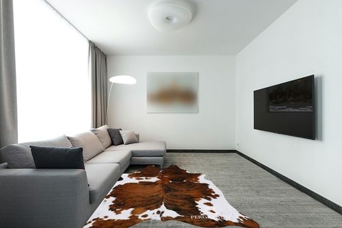 ecowhides 100% Genuine Brazilian Cowhide Rug - Tricolor, Brown, Black & White - Luxury Cowskin Leather Area Rug Decor, (X-Large) 7 x 6 ft in Modern Living Room with Grey Couch