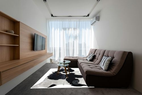 Genuine Black and White Cowhide Rug XL 6 x 7-8 ft. 180 x 240 cm in Grey Living Room with Brown Couch