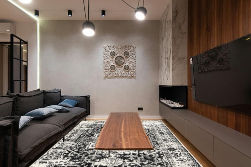 nuLOOM Jordana Vintage Distressed Medallion Area Rug, 8x10, Black and White in Dark Wood Living Room with Black Couch