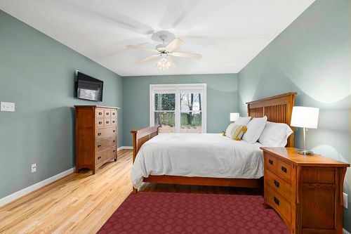 Garland Rug Sparta 4 ft. x 6 ft. Area Rug Chili Red in Teal and Orange Wood Bedroom