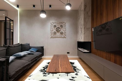 HIDES BAZAAR Classic Black and White Cowhide Rug, Premium Quality Genuine Leather Cow Hide, Area Rug (6x7 ft) in Dark Wood Living Room with Black Couch