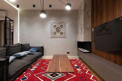 SAFAVIEH Farmhouse Collection 8' x 10' Red/Gold FMH599Q Moroccan Boho Tassel Area Rug in Dark Wood Living Room with Black Couch
