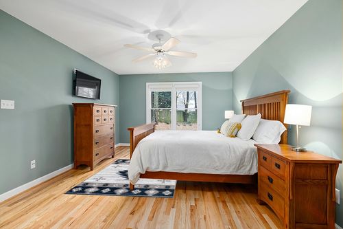 Well Woven Southwestern Rodrigo 5'3" x 7'3" Blue Area Rug in Teal and Orange Wood Bedroom