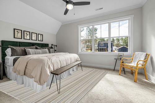 Garland Rug Carnival Stripe 9 Ft. x 12 Ft. Earth Tone Area Rug in Grey Traditional Bedroom with King Bed