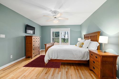 Well Woven Elle Basics | Emerson Shag Deep Red | Textured (5'3" x 7'3") Area Rug in Teal and Orange Wood Bedroom