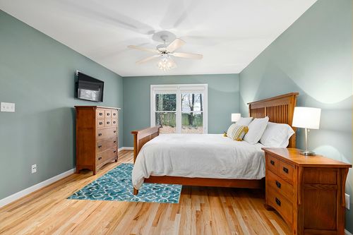 Wonnitar Moroccan Machine Washable Area Rug in Teal and Orange Wood Bedroom