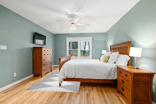 Washable Diamond Stripes Area Rug in Teal and Orange Wood Bedroom