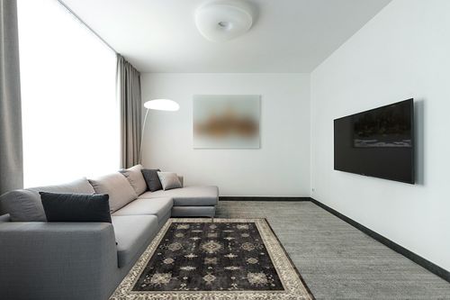 RUGGABLE – Verena Dark Wood – Machine Washable Area Rug – Pet & Child Friendly – Stain & Water Resistant – Non-Slip – 5'x7' in Modern Living Room with Grey Couch