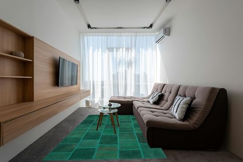 BESPOKY 6'5" x 9'8" (195x295 Cm) Teselya Green Patchwork Wool Handmade Area Rug in Grey Living Room with Brown Couch
