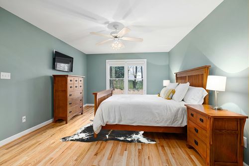 HIDES BAZAAR Dark Brindle Cowhide Rug, Premium Quality Genuine Leather Cow Hide, Dark Brown, Black and White Area Rug (6x7 ft) in Teal and Orange Wood Bedroom