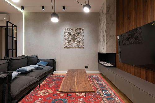 SAFAVIEH Vintage Hamadan Collection Area Rug - 9' x 12', Orange & Blue, Oriental Traditional Persian Design, Non-Shedding & Easy Care, Ideal for High Traffic Areas in Living Room, Bedroom (VTH214C) in Dark Wood Living Room with Black Couch