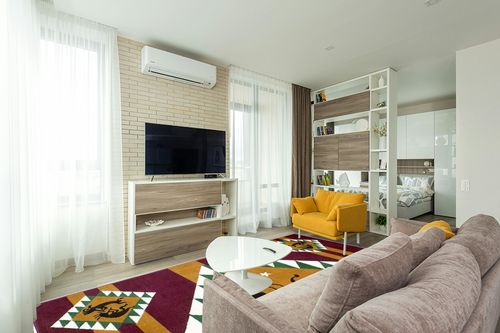 AllStar Rugs Red 8x10 Tribal Area Rug (7' 7" x 10' 6") in Light Modern Living Room with TV