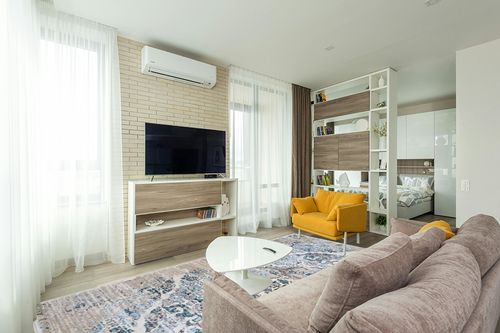 Cream Modern Stain Resistant, Durable, Fade Resistant Area Rug in Light Modern Living Room with TV
