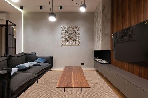 CAMILSON Easy Jute Rug 9x12, Indoor Outdoor Natural Color Farmhouse Area Rugs for Living Room Patio and Kitchen Rug, Solid Boho Woven Design, Easy-Cleaning, Non Slip Washable Outside Carpet (9 x 12) in Dark Wood Living Room with Black Couch