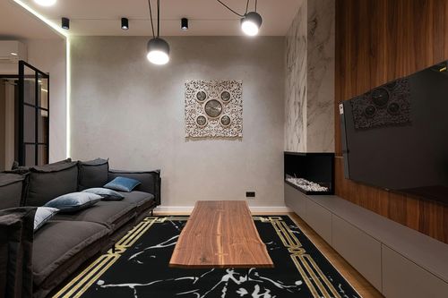 Antep Rugs Babil Gold 8x10 Abstract Marble Geometric Indoor Area Rug (Black, 7'10" x 10') in Dark Wood Living Room with Black Couch