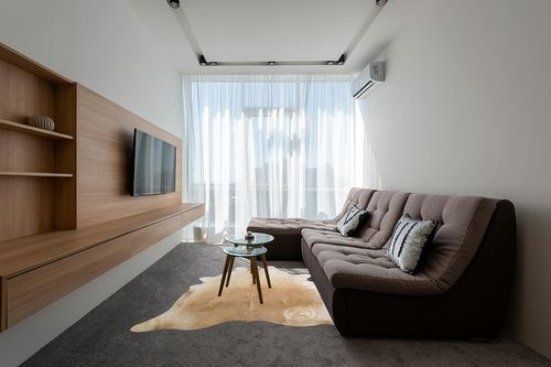 Sunshine Cowhides Genuine Palomino Beige Cowhide Rug - Luxurious Cow Rug for Bedroom, Living Room, and Home Decor Enthusiasts - Masterpiece of Style and Functionality - 6x6-7ft (180x210cm) in Grey Living Room with Brown Couch