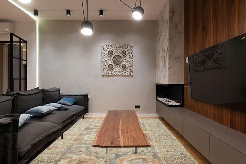 Loloi II Margot Collection MAT-03 Ocean/Spice 7'-6" x 9'-6" Area Rug feat. CloudPile in Dark Wood Living Room with Black Couch