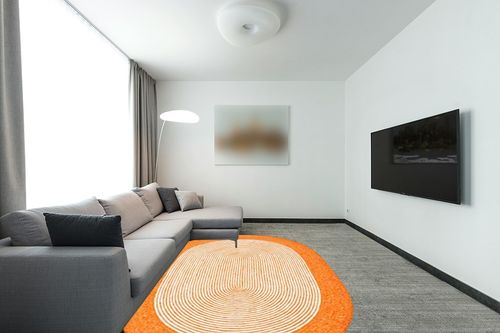 SAFAVIEH Braided Collection 6' x 9' Oval Orange/Ivory BRD904P Handmade Country Cottage Reversible Wool Entryway Foyer Living Room Bedroom Kitchen Area Rug in Modern Living Room with Grey Couch