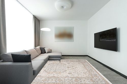 SAFAVIEH Isabella Collection Area Rug - 8' x 10', Cream & Beige, Oriental Design, Non-Shedding & Easy Care, Ideal for High Traffic Areas in Living Room, Bedroom (ISA916B) in Modern Living Room with Grey Couch