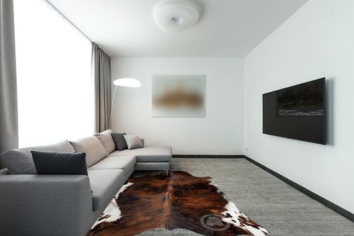 Sunshine Cowhides Genuine Dark Brindle Tricolor Cowhide Rug - Luxurious Cow Rug for Bedroom, Living Room, and Home Decor Enthusiasts - Masterpiece of Style and Functionality - 6x6-7ft (180x210cm) in Modern Living Room with Grey Couch