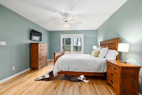 Sunshine Cowhides Genuine Dark Brindle Tricolor Cowhide Rug - Luxurious Cow Rug for Bedroom, Living Room, and Home Decor Enthusiasts - Masterpiece of Style and Functionality - 6x6-7ft (180x210cm) in Teal and Orange Wood Bedroom