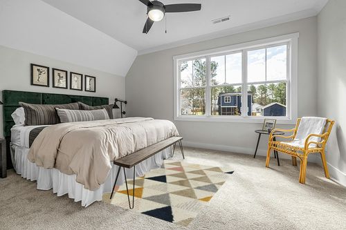 Patao Geometric Ivory/Mustard/Taupe Area Rug Wade Logan Rug Size: Rectangle 5'3" x 7' in Grey Traditional Bedroom with King Bed
