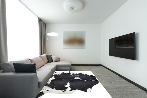 HIDES BAZAAR Dark Tricolor Cowhide Rug, Premium Quality Genuine Leather Cow Hide, Dark Brown, Black and White Area Rug (6x7 ft) in Modern Living Room with Grey Couch