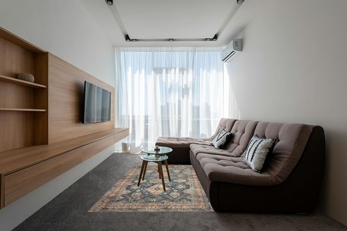 Loloi II Skye Collection SKY-10 SEA / RUST, Traditional 5'-0" x 7'-6" Area Rug in Grey Living Room with Brown Couch