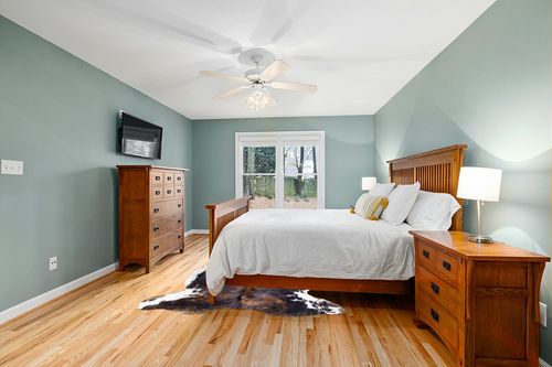 rodeo Genuine Cowhide Rug: Hand-Picked & Authentic Real Cowhide Rug for western Home Decor - Cow Hide Rug Large Sized at 6x7ft - Rustic rug, Unique, Durable, Leather Cow Carpet Rugs - Brindle cowhide rug in Teal and Orange Wood Bedroom