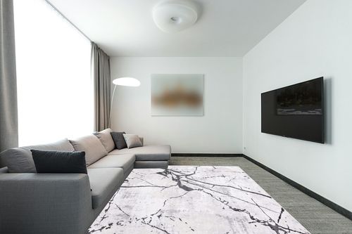 SAFAVIEH Amelia Collection Area Rug - 8' x 10', Grey & Black, Modern Abstract Design, Non-Shedding & Easy Care, Ideal for High Traffic Areas in Living Room, Bedroom (ALA293K) in Modern Living Room with Grey Couch