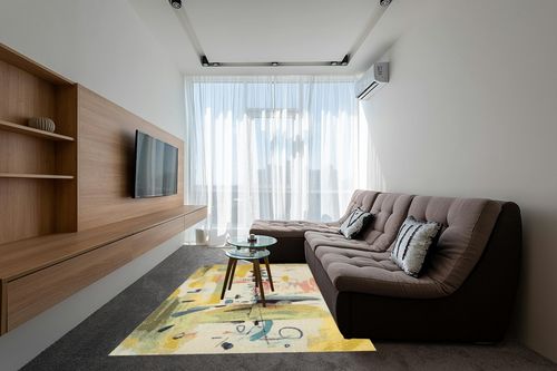 COLORWRKS Sunny Pastels Abstract Area Rug in Yellow Orren Ellis Rug Size ... in Grey Living Room with Brown Couch