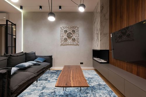 Area Rug Living Room Rugs: 5x7 Washable Rug with Anti-Slip Backing Non-Shedding Stain-Resistant Foldable Modern Abstract Carpet for Bedroom Dining Room Nursery Home Office (Blue) in Dark Wood Living Room with Black Couch