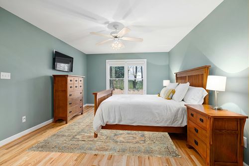 Loloi II Margot Collection MAT-03 Ocean/Spice 7'-6" x 9'-6" Area Rug feat. CloudPile in Teal and Orange Wood Bedroom