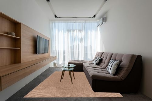 CAMILSON Easy Jute Rug 8x10, Indoor Outdoor Natural Color Farmhouse Area Rugs for Living Room Patio and Kitchen Rug, Solid Boho Woven Design, Easy-Cleaning, Non Slip Washable Outside Carpet (8 x 10) in Grey Living Room with Brown Couch