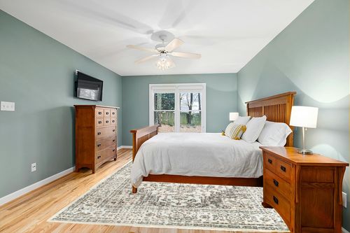 nuLOOM Tanith Vintage Medallion Area Rug, 9x12, Cream in Teal and Orange Wood Bedroom