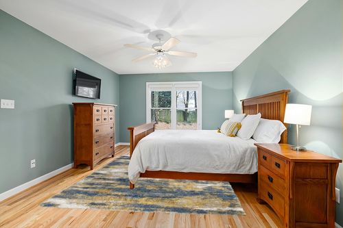 Shag Madison Blue/Gold Rug 17 Stories Rug Size: Rectangle 7'10" x 10' in Teal and Orange Wood Bedroom