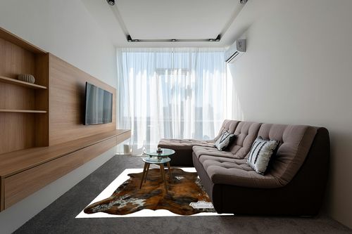 Appaloosa Cowhides Natural Cowhide Rug - Tricolor Cowhide Area Rug for Bedroom & Living Room - Luxury Cowhides Modern Accent Rug - Genuine Leather with Real Animal Fur, Medium, 6 x 8 Feet in Grey Living Room with Brown Couch