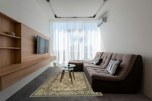 SUPERIOR Indoor Area Rug, Jute Backed, Perfect for Entryway, Office, Living/Dining Room, Bedroom, Kitchen, Hardwood Floor, Floral Medallion Decor, Radcliffe Collection, 6' x 9', Green in Grey Living Room with Brown Couch