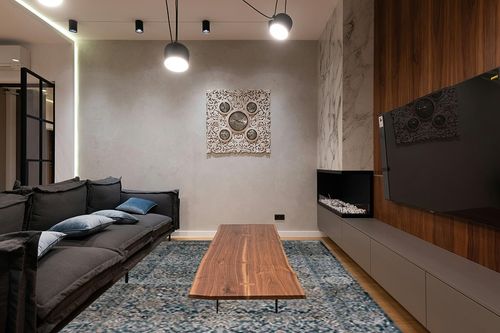 SAFAVIEH Valencia Collection Area Rug - 8' x 10', Blue, Vintage Oriental Design, Non-Shedding & Easy Care, Ideal for High Traffic Areas in Living Room, Bedroom (VAL570M) in Dark Wood Living Room with Black Couch