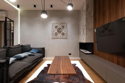 Genuine Brindle Dark Reddish Cowhide Rug XL Size 6 x 7-8 ft. 180 x 240 cm in Dark Wood Living Room with Black Couch