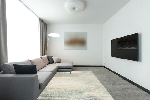 SAFAVIEH Adirondack Collection Area Rug - 6' x 9', Ivory & Sage, Modern Abstract Design, Non-Shedding & Easy Care, Ideal for High Traffic Areas in Living Room, Bedroom (ADR112W) in Modern Living Room with Grey Couch