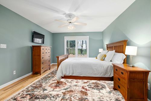 nuLOOM Cecil Vintage Floral Beige 10 ft. x 14 ft. Area Rug in Teal and Orange Wood Bedroom