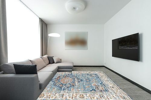 8'x10' Stain Resistant Washable Rug in Modern Living Room with Grey Couch