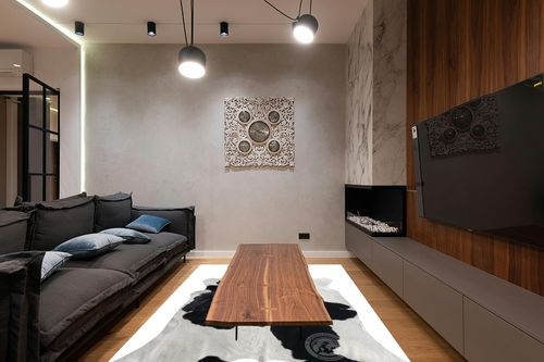 Genuine Black and White Cowhide Rug XL 6 x 7-8 ft. 180 x 240 cm in Dark Wood Living Room with Black Couch