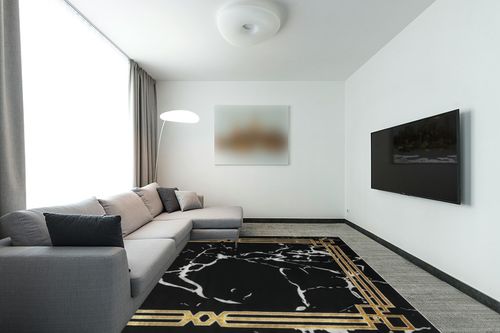 Antep Rugs Babil Gold 8x10 Abstract Marble Geometric Indoor Area Rug (Black, 7'10" x 10') in Modern Living Room with Grey Couch