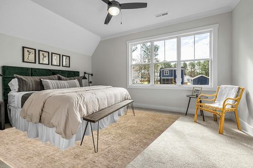 Loloi Magnolia Home by Joanna Gaines Junie Collection JUE-02 Oatmeal/Smoke 9'-6" x 13', .38" Pile Height, Area Rug in Grey Traditional Bedroom with King Bed