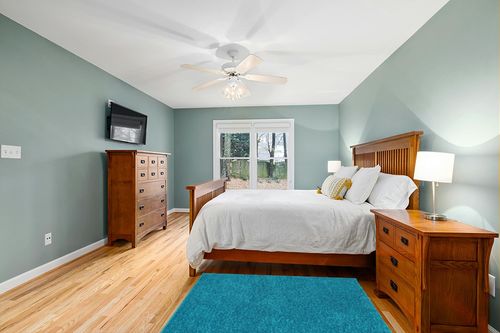 Well Woven Elle Basics | Emerson Shag Teal Blue | Textured Area Rug (3'11" x 5'3") in Teal and Orange Wood Bedroom